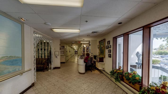 Interior hallway with resident and artwork