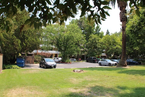 Outdoor view of the facility with parking lot and greenery
