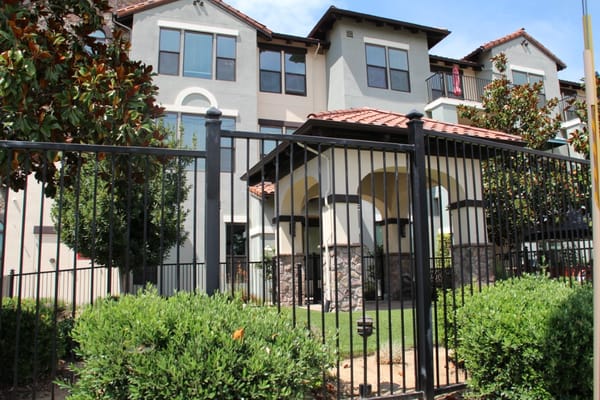 Exterior view of a senior living facility with landscaping