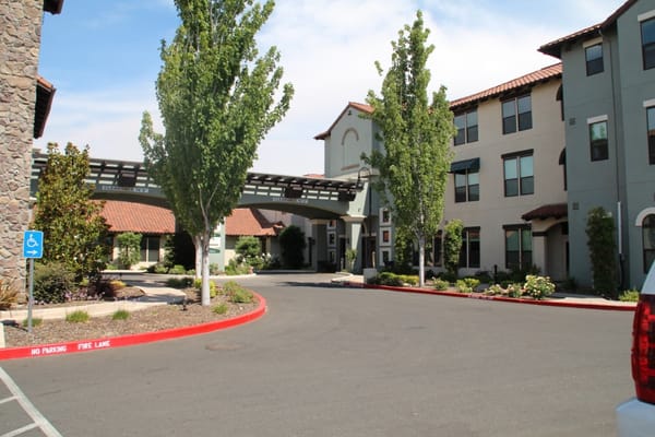Exterior view of Oakmont of East Sacramento with landscaped entrance