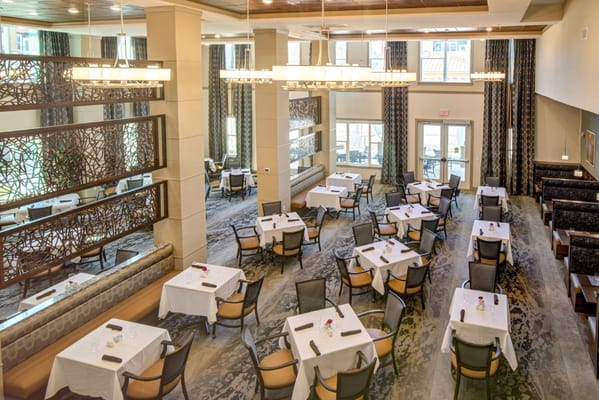 Dining room with tables set for residents