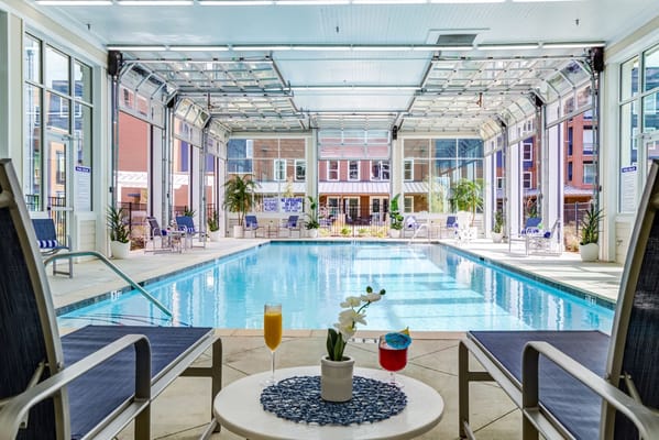 Indoor pool with seating area and drinks