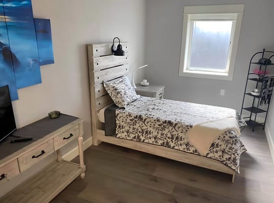 Private resident room with a bed and decor