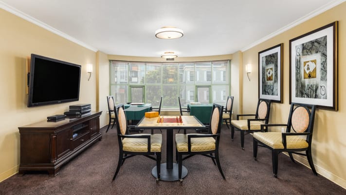 Bright game room with chairs and a board game