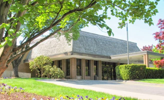 Exterior view of the facility with landscaping and entrance
