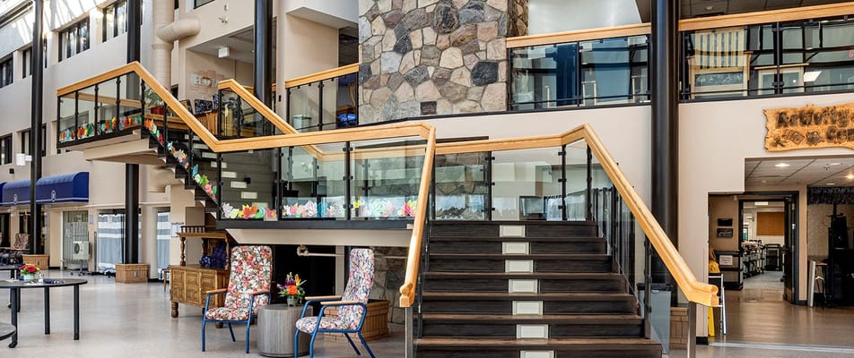 Interior view of a bright common area with stairs
