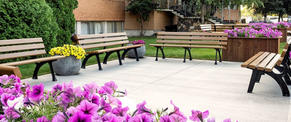 Outdoor seating area with colorful flowers