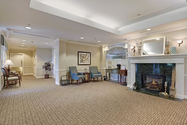 Comfortable common area with seating and a fireplace
