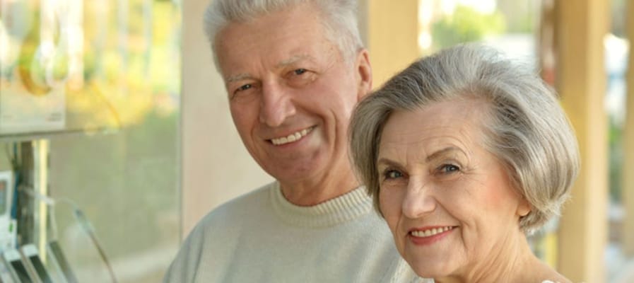 Smiling elderly couple outdoors