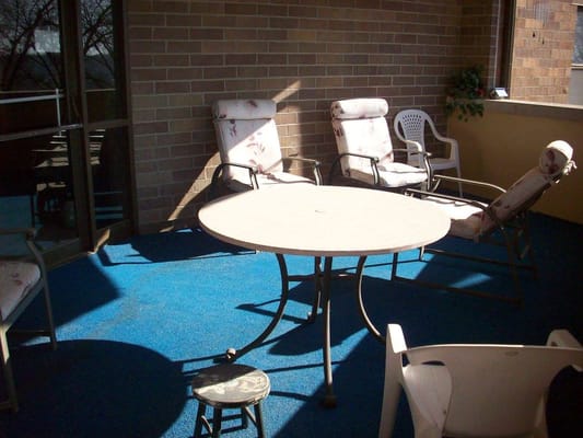 Outdoor seating area with chairs and a table