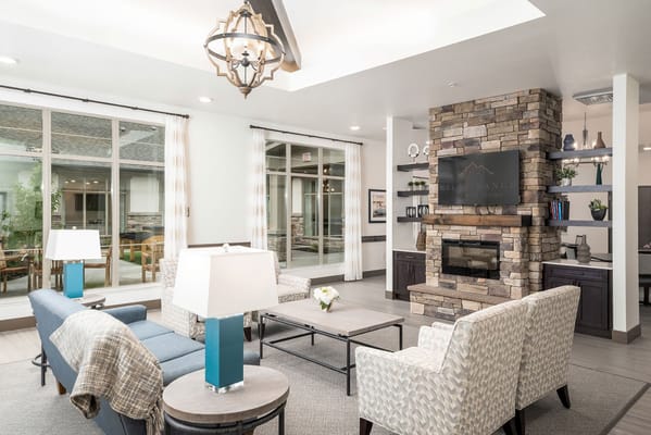 Cozy living room with modern decor and a stone fireplace
