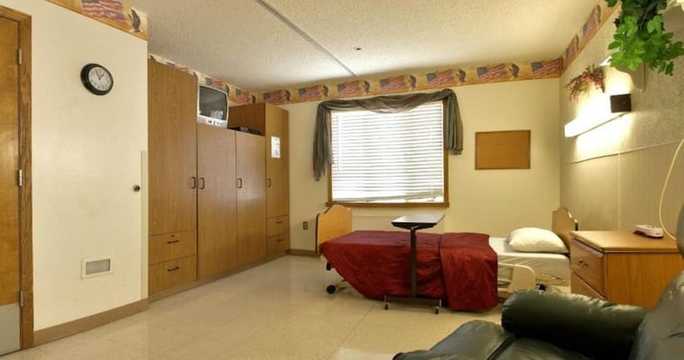 Private resident room with a bed and furniture