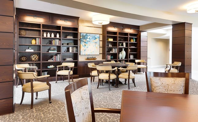 Cozy common area with bookshelves and seating