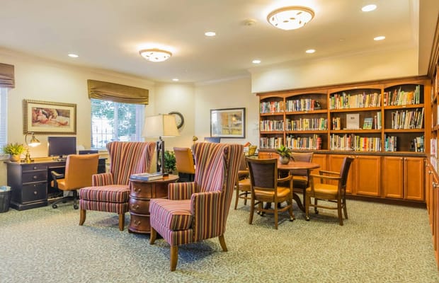 Cozy library with seating and bookshelves