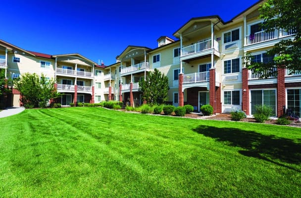 Exterior of Lakeview Senior Living with green lawn and landscaped areas