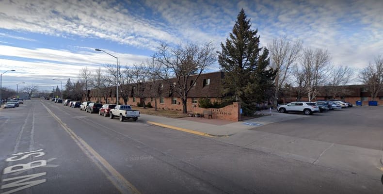 Exterior view of Laurel Gardens Apartments on a clear day