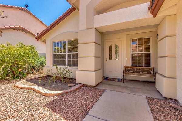 Welcoming entrance of a residential facility with landscaping