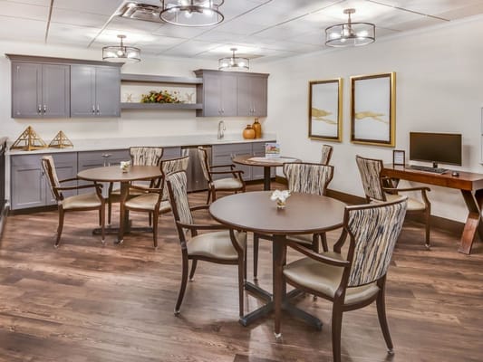 Bright common area with tables and chairs