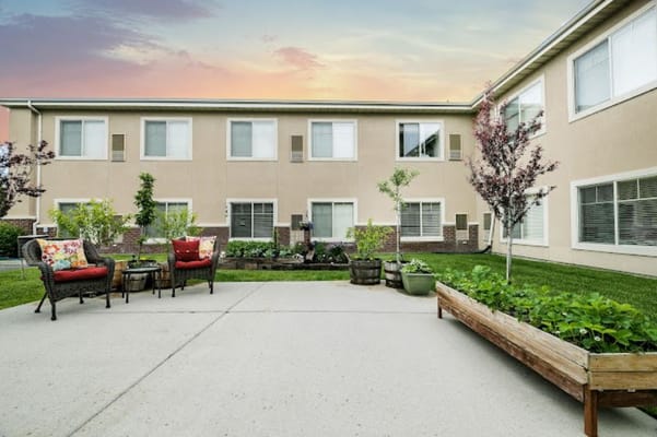 Outdoor seating area with garden at the facility