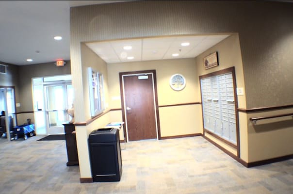 Interior view of a hallway with mailboxes