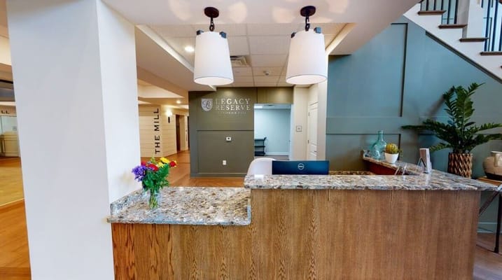 Reception area with a welcoming front desk and decor