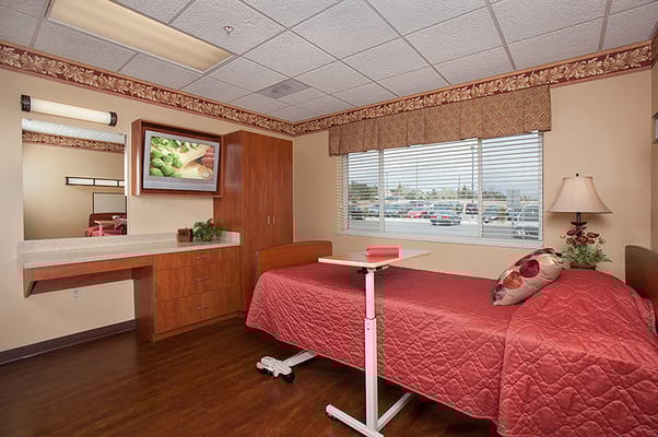 Private room with a bed and window