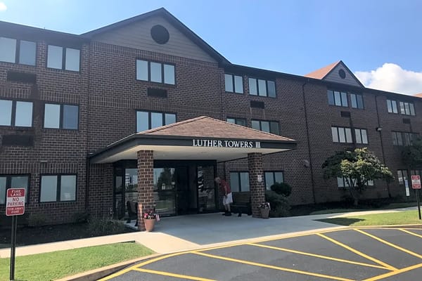 Exterior view of Luther Towers II with entrance and landscaping