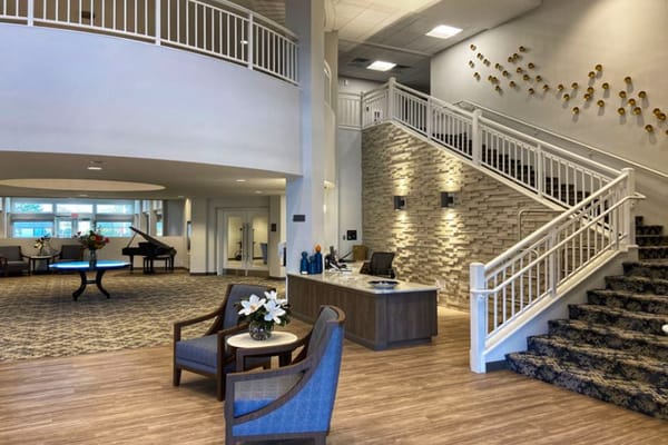 Bright lobby area of a retirement community with seating