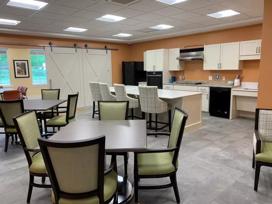 Bright common area with modern kitchen and seating