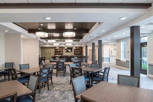 Bright dining room with tables and chairs