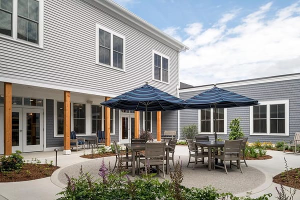 Outdoor courtyard area with seating and umbrellas