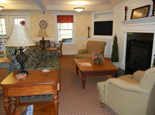 Comfortable living room with seating and a fireplace