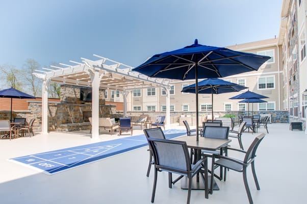 Outdoor patio area with seating and umbrellas