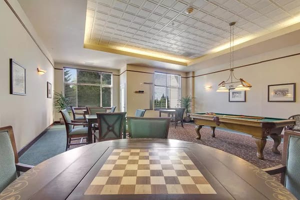 Common area with a checkered table and pool table