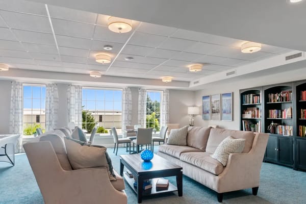 Bright common area with comfortable seating and natural light