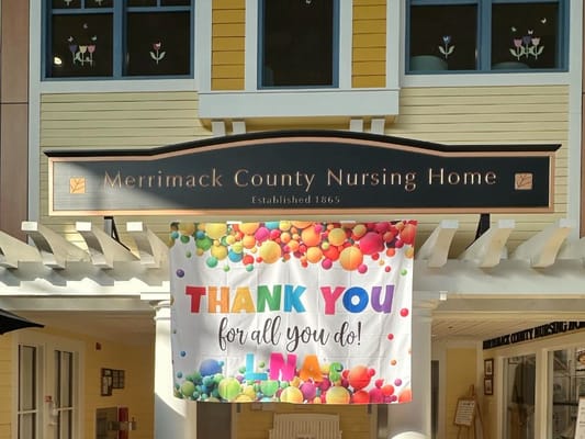Exterior view of the nursing home with a thank you banner