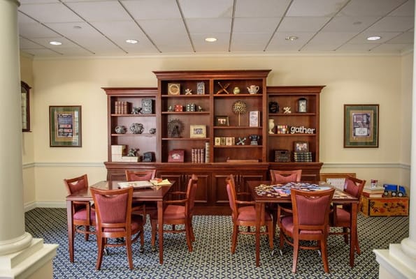 Dining area with wooden furniture and decorative shelves