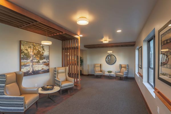 Comfortable common area with seating and artwork