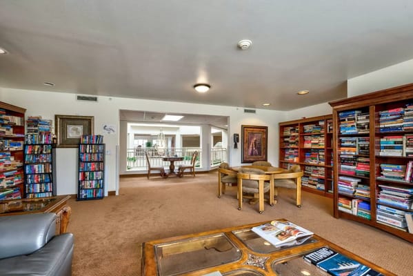 Cozy common area filled with books and seating
