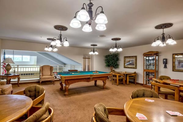 Interior view of a recreational room with pool table