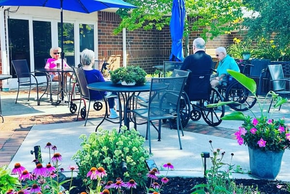 Residents enjoying time outdoors in a garden area