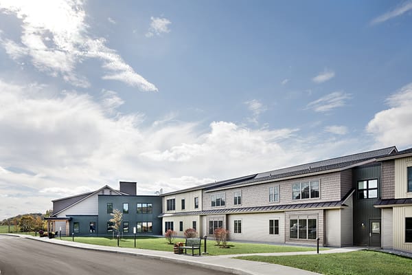 Exterior view of Morgan Orchards Senior Living Community with blue sky