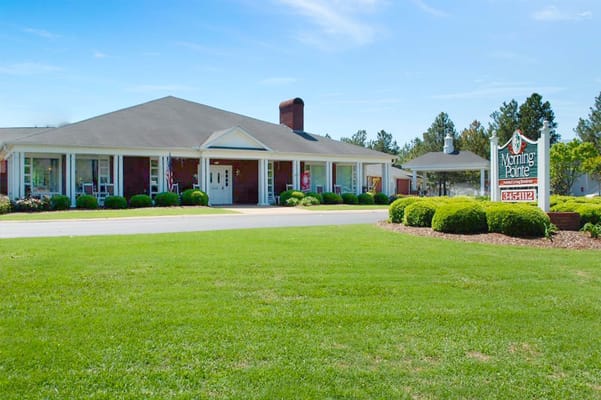 Exterior view of Morning Pointe facility with landscaped lawn