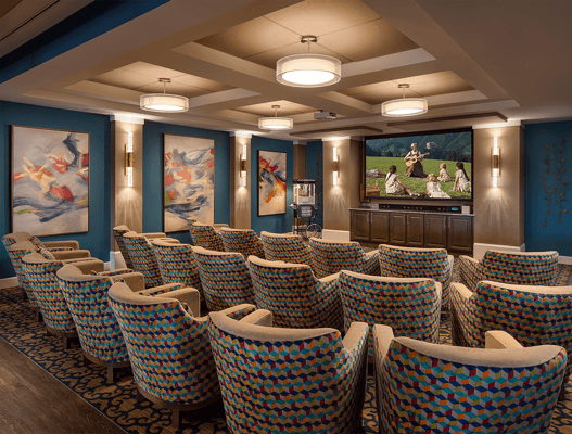 Comfortable interior theater room with colorful seating