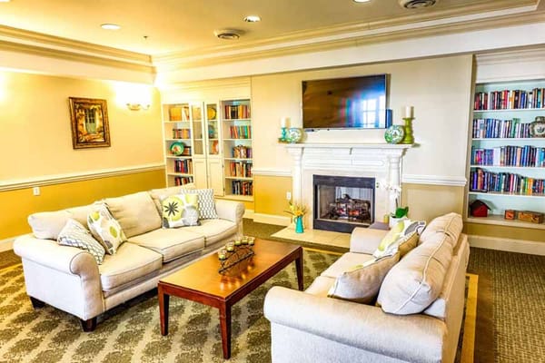 Common area with seating and a fireplace