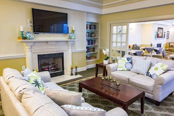 Cozy lounge area with comfortable seating and fireplace