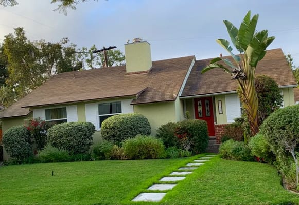 Exterior view of a residential building with landscaping