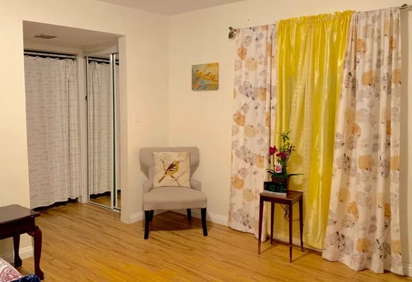 Cozy interior space with seating and curtains