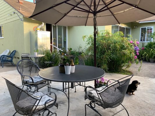 Outdoor patio area with a table and chairs