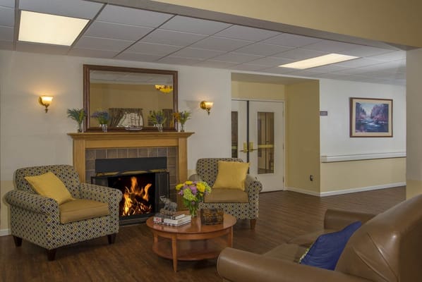 Cozy common area with a fireplace and seating